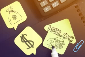 Sticky notes with the words HELOC and home equity, representing a home equity line of credit concept.